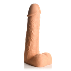 Side profile of light-tone realistic dildo showing detailed veining and textured shaft surface