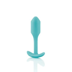 Side profile of mint Snug Plug 1 showing slim neck, smooth silicone finish, and curved base