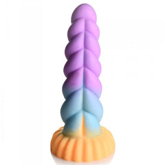 Side profile of Mystique silicone dildo revealing ridged spine detail along twisted shaft