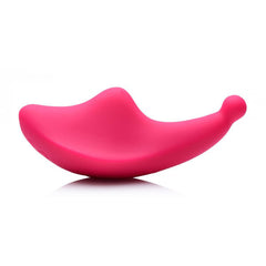 Side profile of pink silicone panty vibe showing curved body and stimulation tip