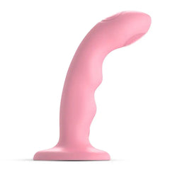 Side profile of the pink Wave M dildo showing curved shaft and suction cup base