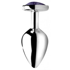 Side profile of a polished stainless steel anal plug showing tapered shape and purple heart gem