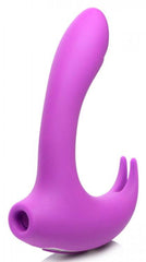 Side profile of purple silicone rabbit vibrator with curved G-spot shaft and clitoral prongs, suction port visible