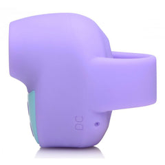 Side profile of Shegasm Mini showing finger-ring base and magnetic DC charging port
