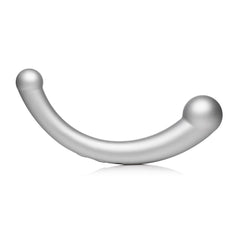 Side profile of silver curved G-spot wand resting on surface, showing ergonomic arc and matte finish