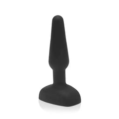 Side profile of smooth black silicone b-Vibe Trio Plug showing tapered shape and flat base