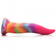 Side profile of the Unicorn Kiss rainbow silicone dildo lying flat, showing curved tongue-like shape