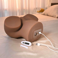 Side view showing USB charging cable, control panel, and included syringe accessory of the stroker