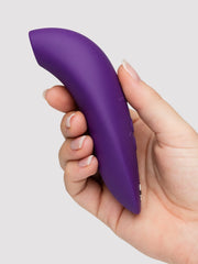 Side view of We-Vibe Melt 2 in hand revealing slim ergonomic profile and button panel
