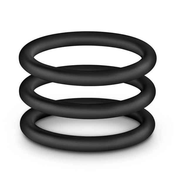 Silicone Cock Ring Trio stacked flat, revealing three graduated sizes in soft, body-safe black silicone