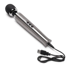 Silver Le Wand Die Cast Massager connected to USB charging cable on white background