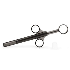 Single black lubricant applicator shown disassembled with plunger tip beside barrel