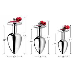 Size diagram of Red Gem with Bells Anal Plug Set: 1.1" to 1.6" wide, 3.1" to 4.1" tall