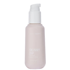 Skinny Dip pheromone body mist showing pump dispenser top on a matte blush cylindrical bottle