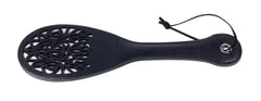 Slightly angled view of black paddle showing lace cut-out detail and wrist loop cord
