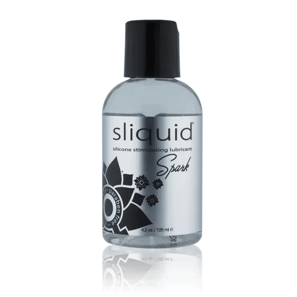 Sliquid Spark silicone lubricant in a clear 4.2 oz bottle with a black flip-top cap
