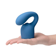 Small blue Le Wand Glider Petite silicone attachment resting on an open palm