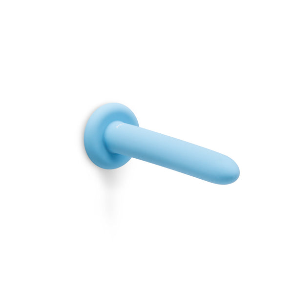 Smallest b-Vibe silicone dilator shown horizontally with suction base against surface