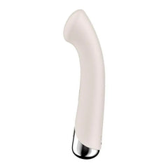 Smooth beige silicone G-spot vibrator with curved shaft and polished silver base, side angle view