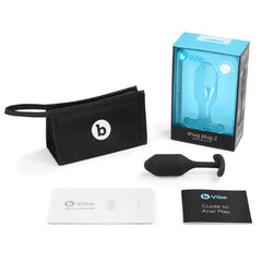 Snug Plug 2 displayed with storage pouch, user guide, anal play booklet, and retail box