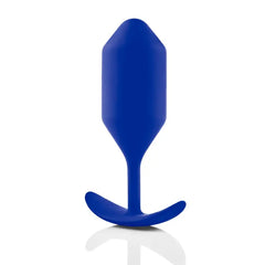 Snug Plug 4 in navy blue silicone with faceted tip and curved anchor base, side profile with reflection