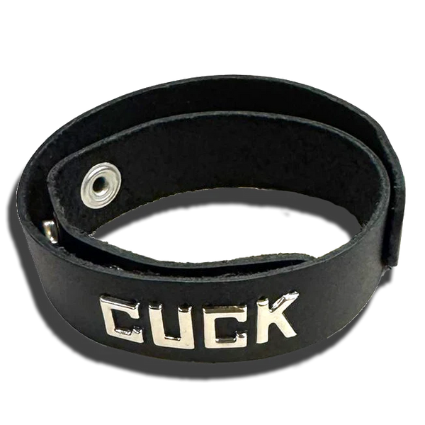 Spartacus CUCK black leather wristband collar with silver snap closure and metal lettering