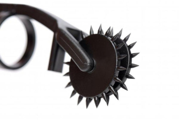 Close-up of spiked rotating wheel on the Thorn Double Finger Pinwheel, dark finish