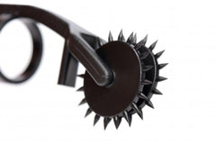 Close-up of spiked rotating wheel on the Thorn Double Finger Pinwheel, dark finish