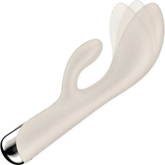 Spinning Rabbit 1 mid-rotation demonstrating rotating shaft movement in beige silicone