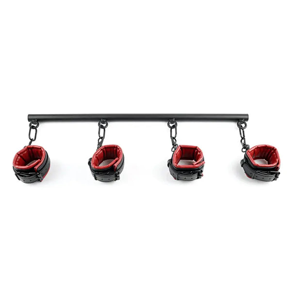 Sportsheets Saffron Spreader Bar with four red and black padded cuffs hanging by chains