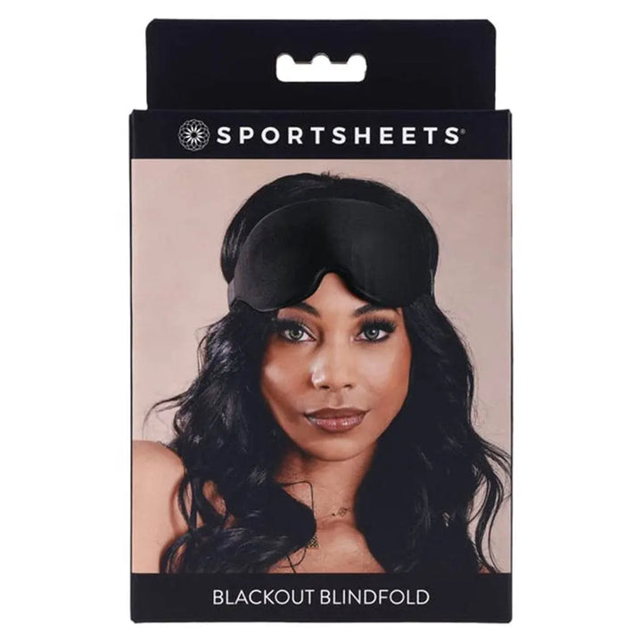 Sportsheets Blackout Blindfold in black shown on packaging with model wearing the mask