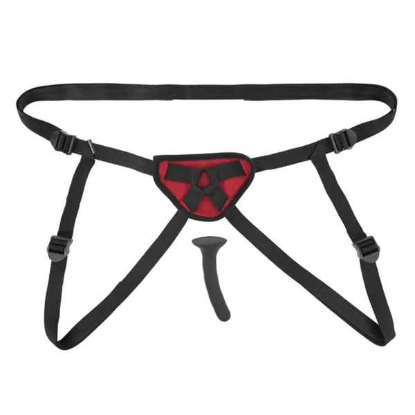 Sportsheets Saffron Silicone Pegging Kit laid flat showing black harness straps and red panel