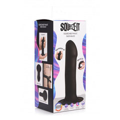 Squeeze-It Squeezable Phallic Dildo packaging showing bendable silicone features and harness compatibility