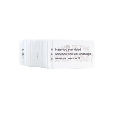 Stacked white question cards fanned open revealing bold black text on rounded-corner card stock