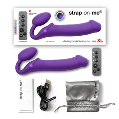 Strap-On-Me XL purple unboxed contents including remote, USB cable, and storage pouch