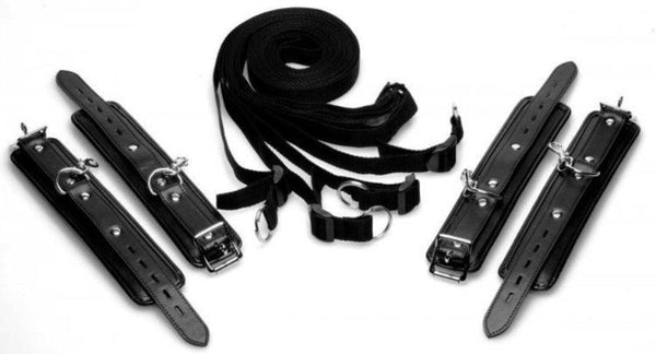 Strict Bed Restraint Kit laid flat showing four black padded cuffs and nylon straps