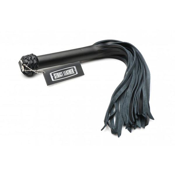 Strict Leather Beginner Flogger showing braided pommel, label tag, and black suede falls
