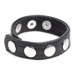 Strict Leather black leather cock ring with five silver snap fasteners, close-up