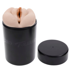 Stroker insert seated upright in the open black canister with the lid placed beside it