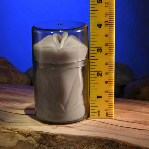 Stroker in sealed clear jar next to ruler indicating approximately 4.5 inch height