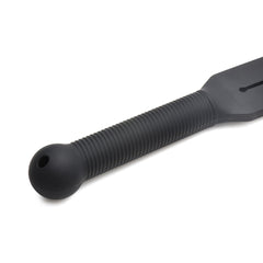 Close-up of Stung Silicone Tawse ribbed grip and ball pommel end, highlighting textured silicone surface