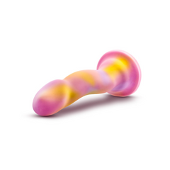 Sun's Out pink and yellow marbled silicone dildo laid horizontally showing suction cup base
