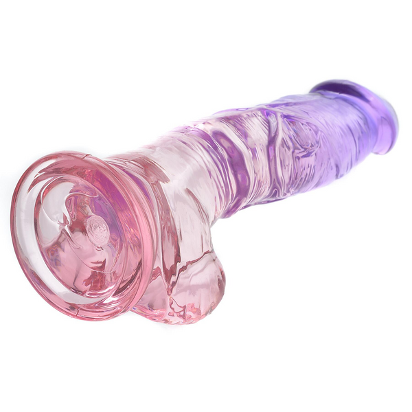 Sunset Dreams Dildo laid flat highlighting flat suction cup base for hands-free stability