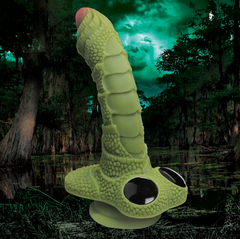 Swamp Monster dildo displayed against moody swamp backdrop highlighting reptile-inspired design