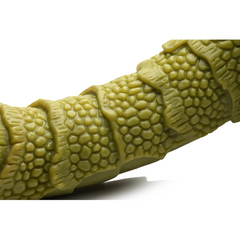 Close-up of Swamp Monster dildo shaft showing raised segmented scales and detailed pebbled texture