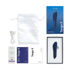 Tango X unboxed showing vibrator, satin pouch, USB cable, lube sachet, and manual