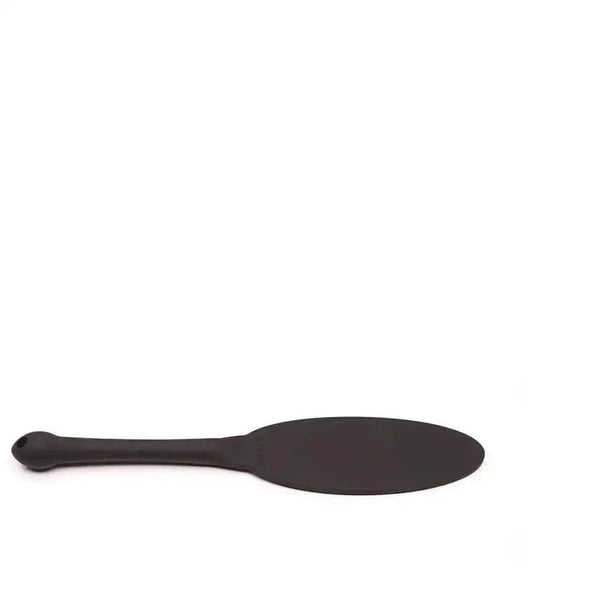 Tantus Gen Silicone Impact Paddle in onyx black with oval head and slim handle
