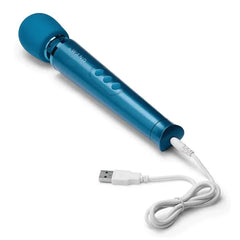 Teal Le Wand Petite Massager shown with white USB charging cable attached to base