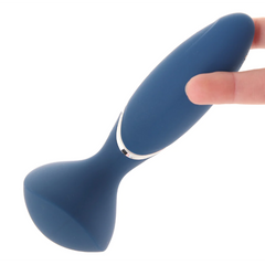 Teal Mini Wand-er wand vibrator held between fingers, showing flexible neck and ergonomic grip