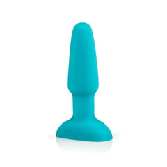 Teal silicone anal plug standing upright showing smooth tapered body and flat base